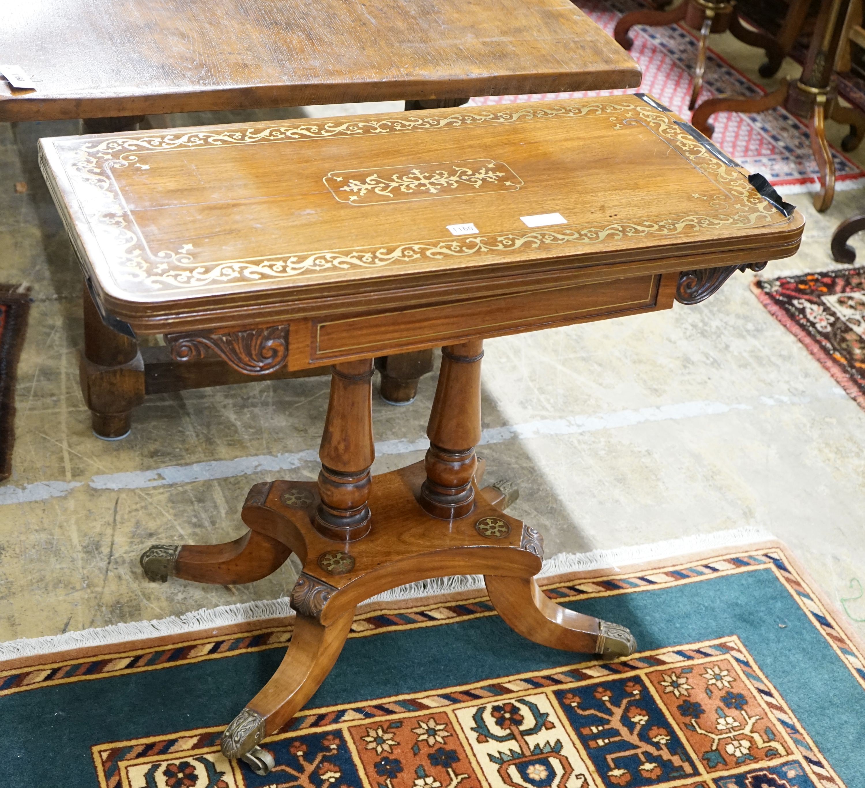 A Regency brass inlaid mahogany rectangular folding card table, width 86cm, depth 43cm, height 74cm